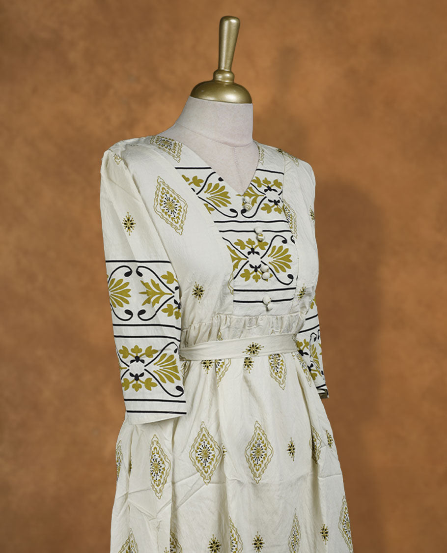 Ivory printed knee-length A-line dress with V-neckline, olive and black ethnic motifs, three-quarter sleeves, and a detachable waist belt for a cinched fit.