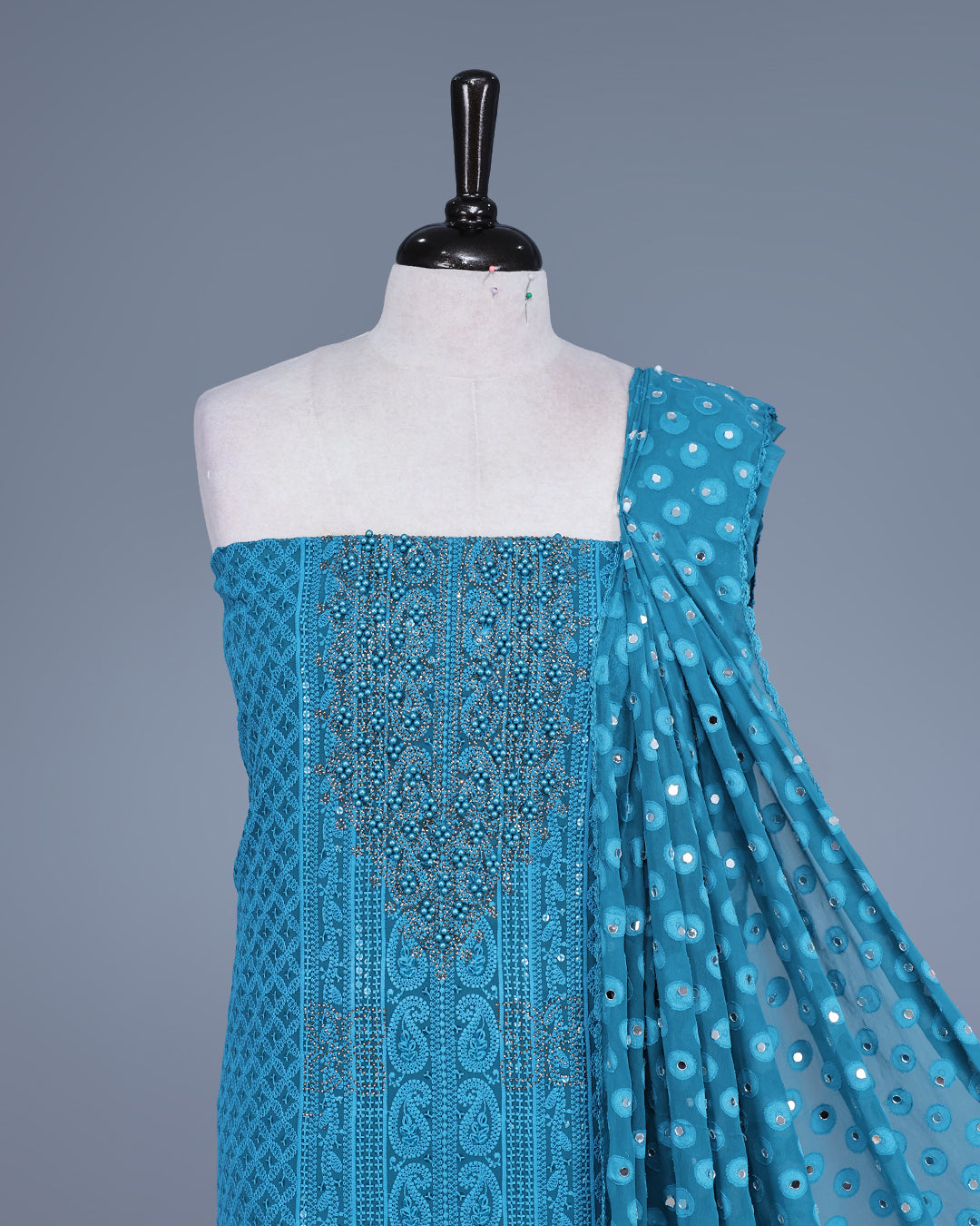 Teal Blue Colour Georgette Salwar Material featuring elegant Chikankari Work on the kurta, paired with a matching bottom & elegant sequined Dupatta.