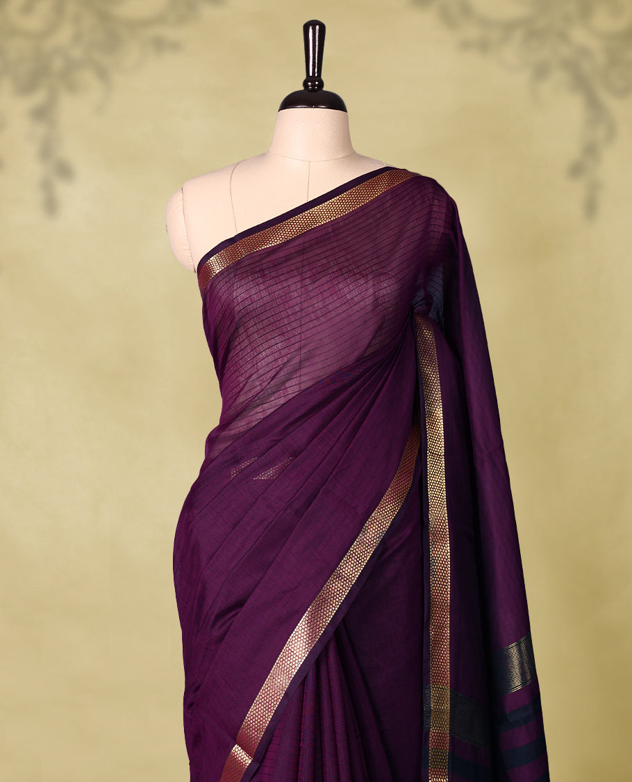 Deep Grape Purple colour chanderi cotton saree with fine striped body, mangalgiri border, grand pallu featuring Black and gold zari stripes, with matching blouse.
