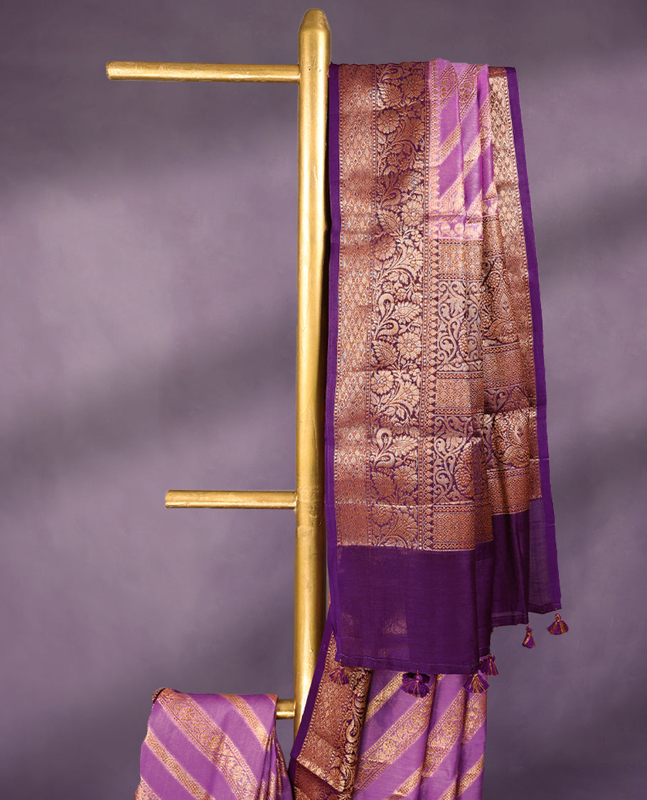 Lavender colour pure Banarasi Chanderi cotton, exquisitely detailed with traditional antique zari Aada designs across the body, finished with a hand-dyed contrast traditional border and a matching blouse.
