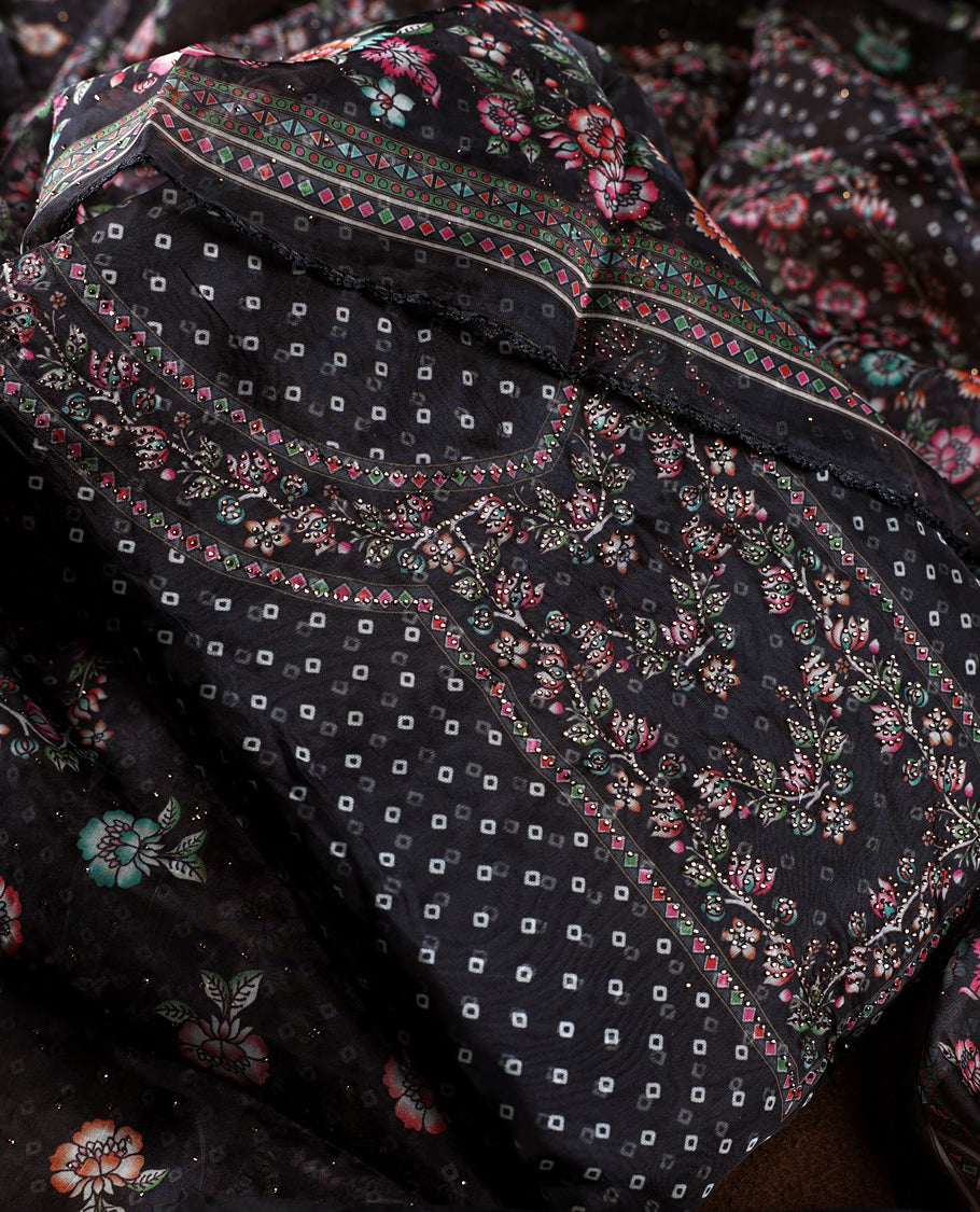 Chic black churidhar material adorned with delicate floral, stone and vine motifs, paired with a vibrant printed dupatta and plain matching bottom, offering a perfect blend of elegance and festive charm.
