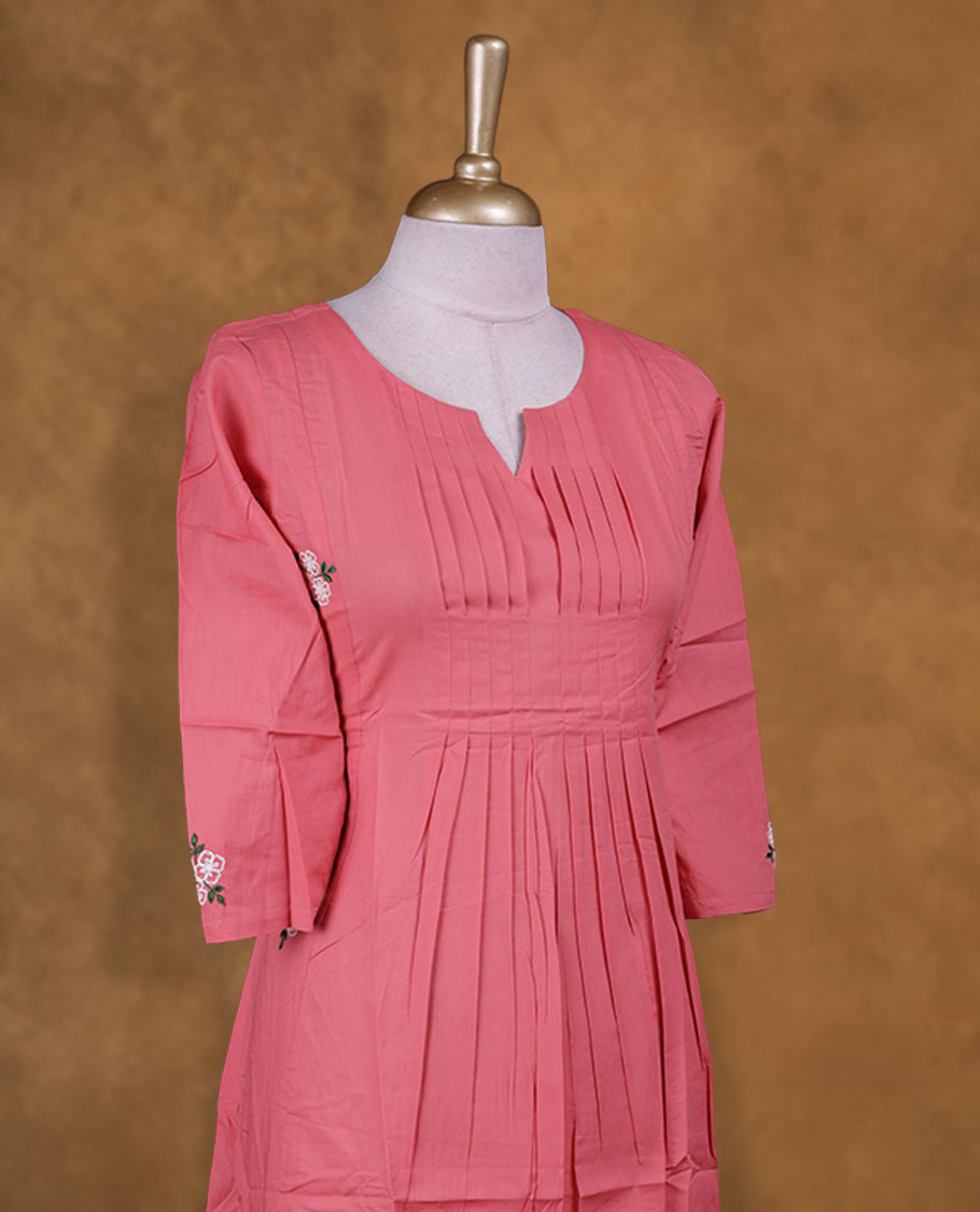 Pink colour kurti styled with a floral thread pattern Round neckline, knee length design, styled with a Round neckline and a sleeve .