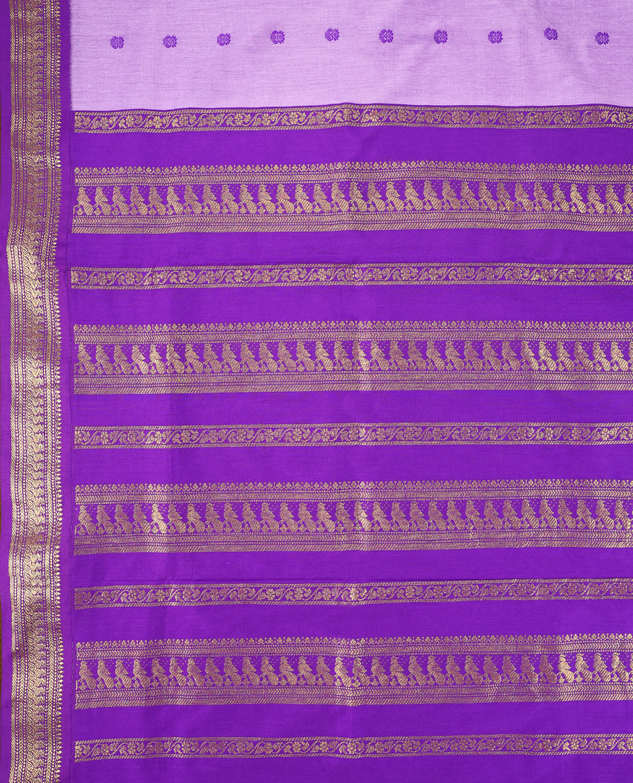 Lavender colour mixed Kalyani cotton saree featuring Purple zari motifs throughout the body, paired with Purple colour traditional border and pallu, with matching blouse