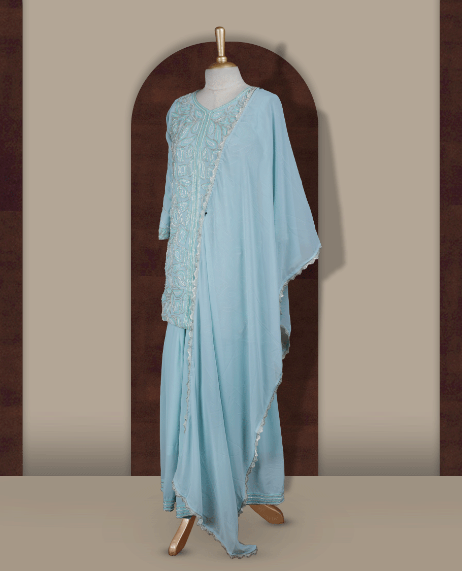 Elegant Ice blue colour embroidered sharara set featuring intricate sequins and cut beads work, paired with a soft matching dupatta edged with delicate detailing and a beautifully flared bottom for a graceful festive look.