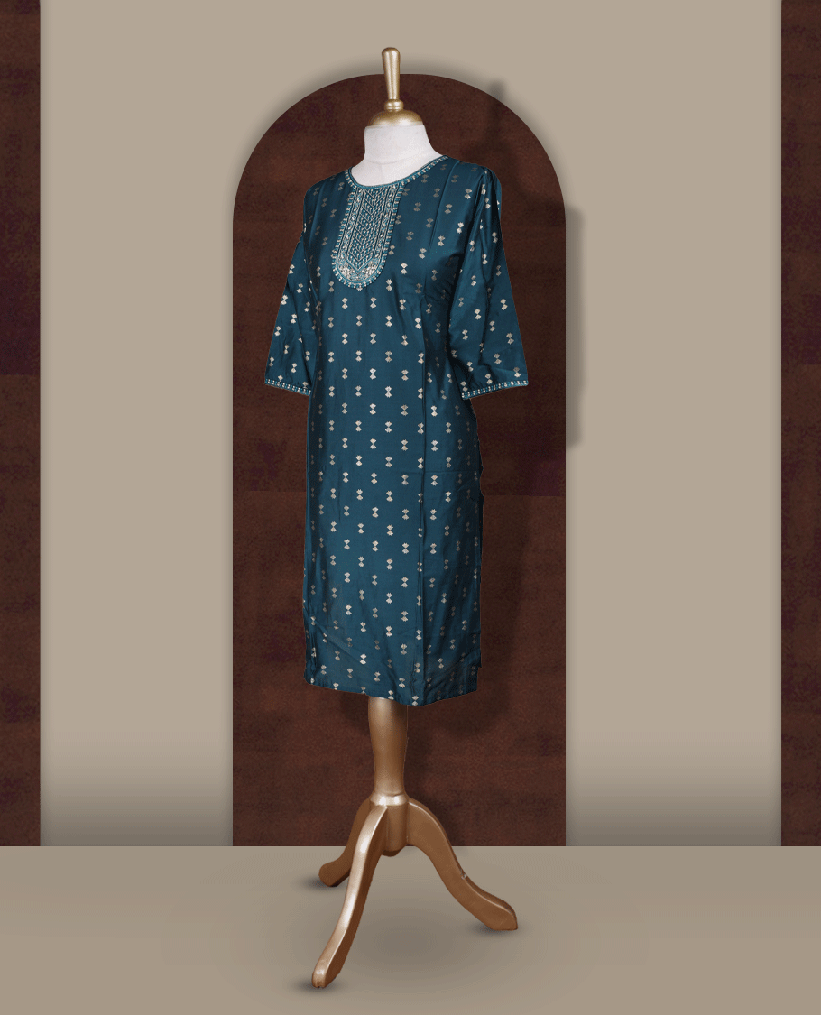 Dark peacock green colour kurti from TWARA, featuring intricate golden foil prints all over and elegant embroidery on the neckline, finished with a round neck and elbow length sleeves.