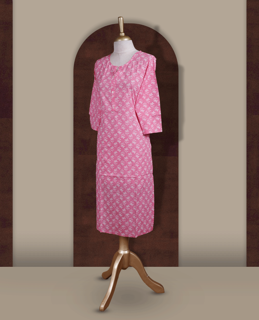 Soft pink colour kurthi with off white floral prints, crafted from soft cotton for a breezy and elegant look & styled with a round V notch neckline and comfortable 3/4th sleeves and a button down front.