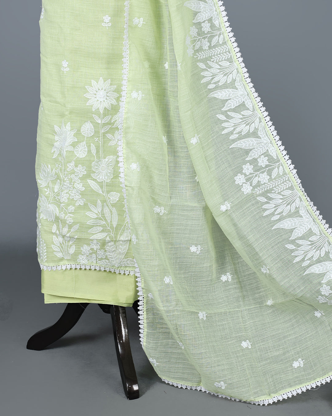 Pastel Lime Green Colour Kotta Net Salwar Material featuring delicate white floral embroidery on the kurta and dupatta, paired with a matching solid bottom for a fresh, elegant, and graceful ethnic look.