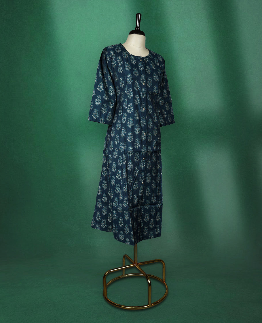 Navy blue colour kurti with a round neck and three quarter sleeves, featuring elegant light blue floral block prints for a classic ethnic look, perfect for casual outings or semi formal occasions.