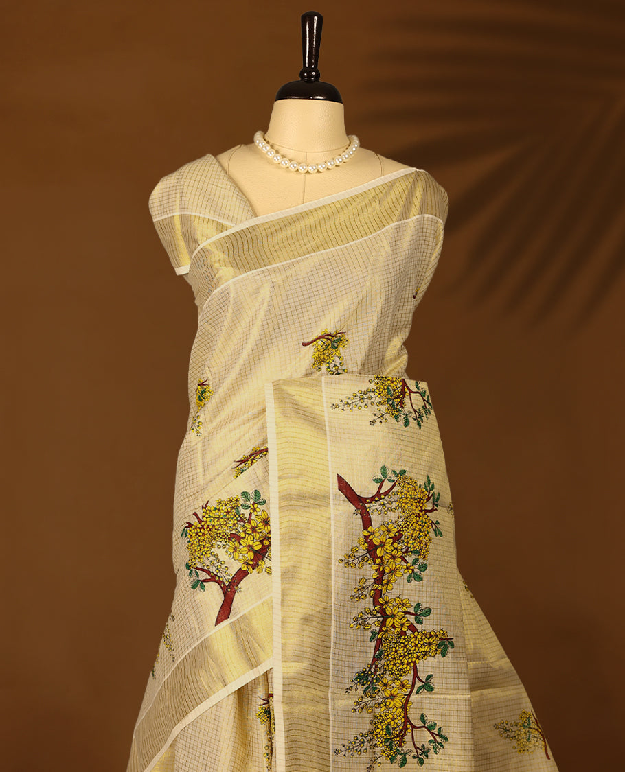 Golden Kerala Tissue saree adorned with vibrant tree-floral motifs and subtle golden border with Matching Blouse