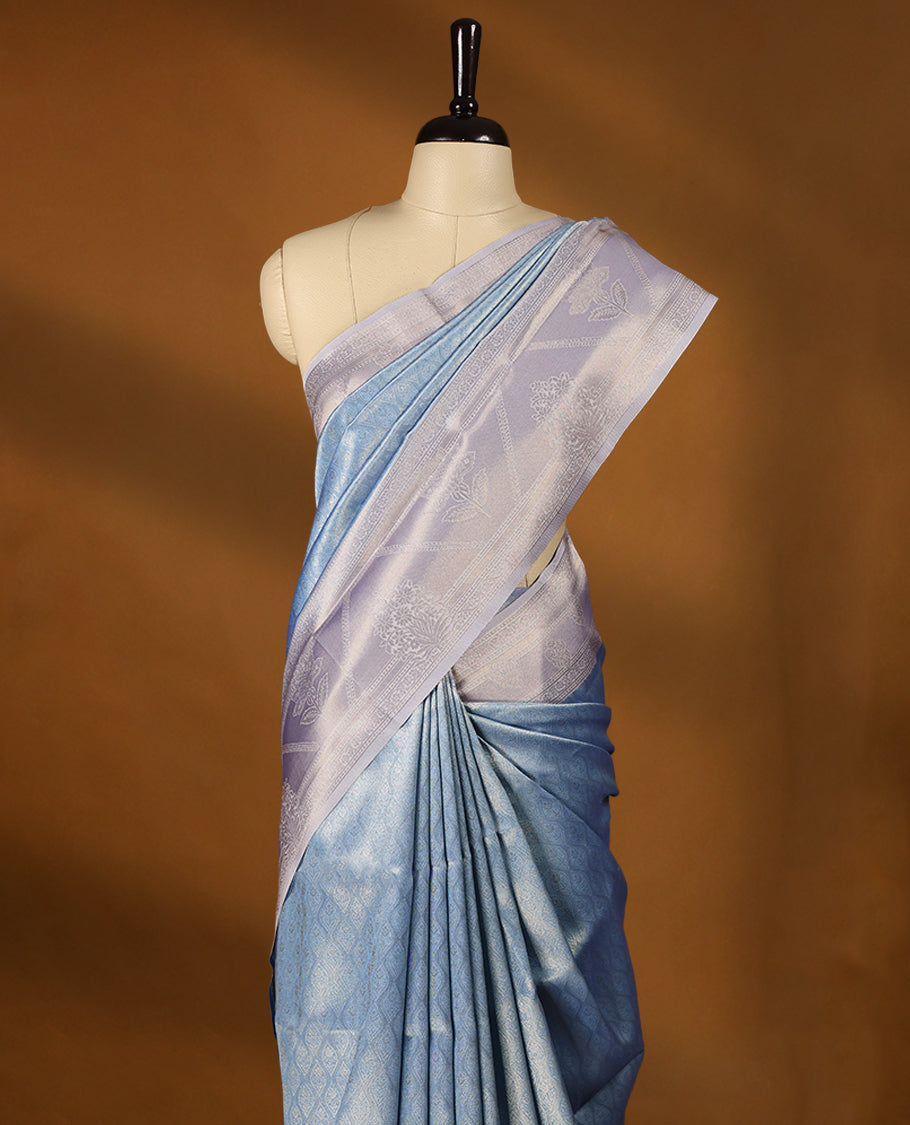 Light Blue coloured semi silk saree featuring a Golden Brocade body, paired with a Light Pastel Purple coloured border and matching blouse.