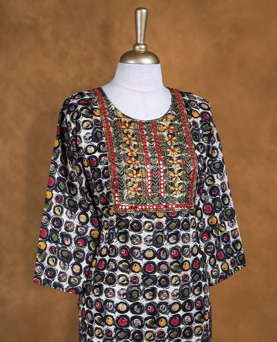 Black colour kurti decked with multicolour circular prints all over, featuring a heavily embroidered yoke with mirror accents, a scoop neckline and comfy 3/4th sleeves.