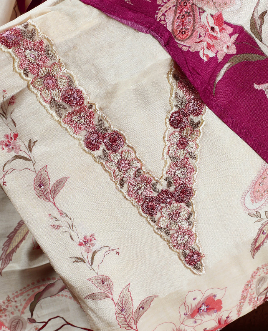 Cream colour churidhar material with pink floral and paisley prints, enhanced by a dark magenta border and delicate embroidery & Comes with matching plain bottom and dupatta.