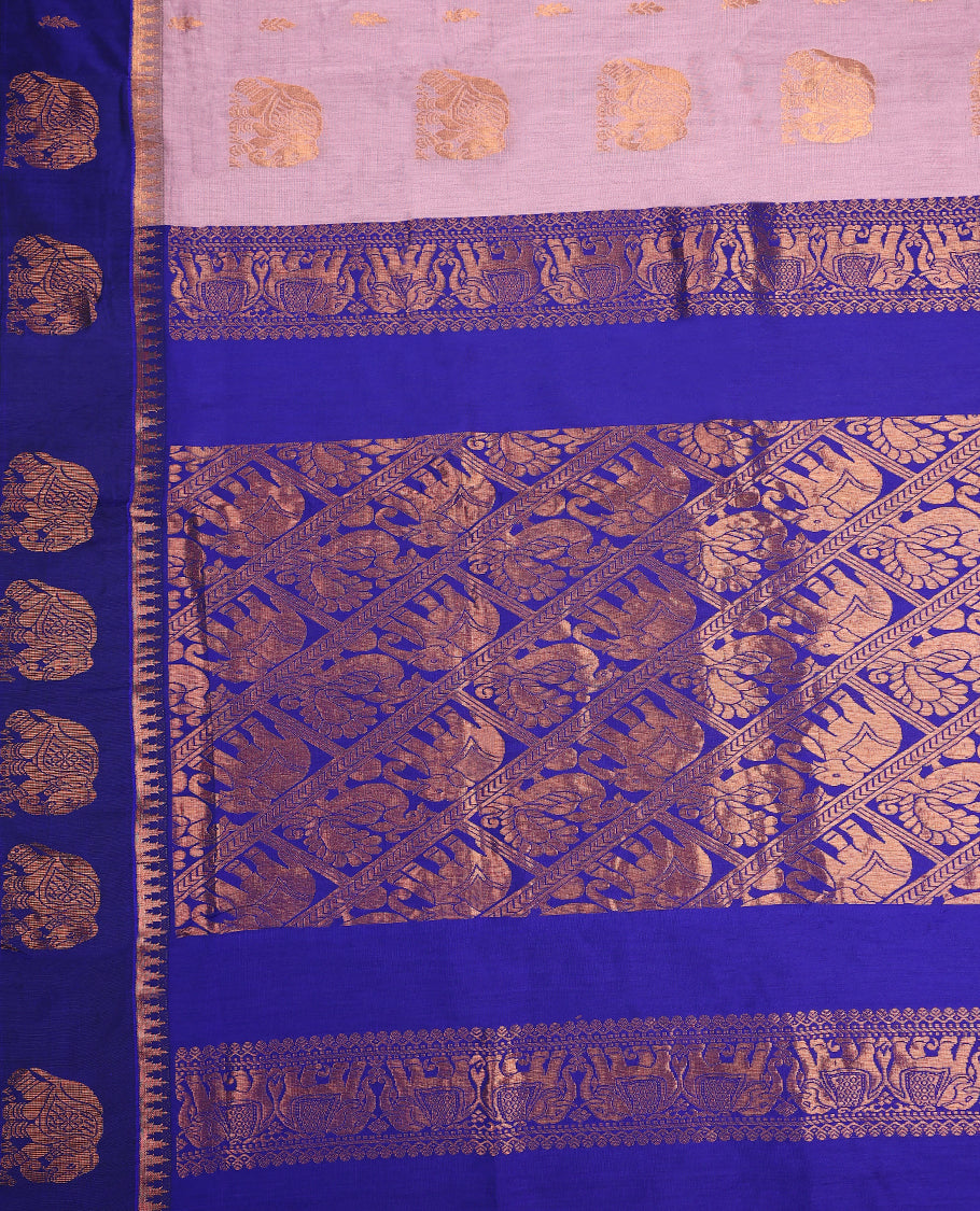 Dual shade Lavender and Royal Blue Kalyani cotton saree featuring intricate zari woven elephant motifs across the body, complemented with a rich zari border and pallu, paired with a matching blouse.