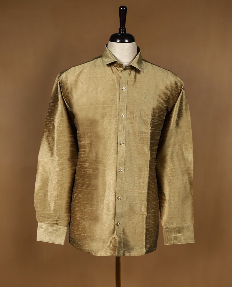 Antique Gold colour DH men’s shirt crafted in a lustrous semi silk textured fabric featuring a sleek finish, classic collar, full sleeves, and chest pocket perfect for weddings and festive occasions