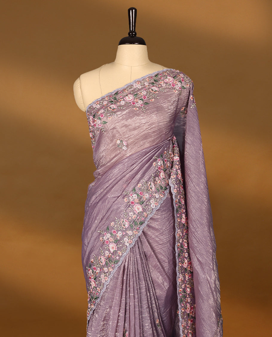 Mauve Crush Soft Silk saree featuring Floral Thread Works on the body, complemented by delicate embroidery in pink and green tones border and a matching blouse.