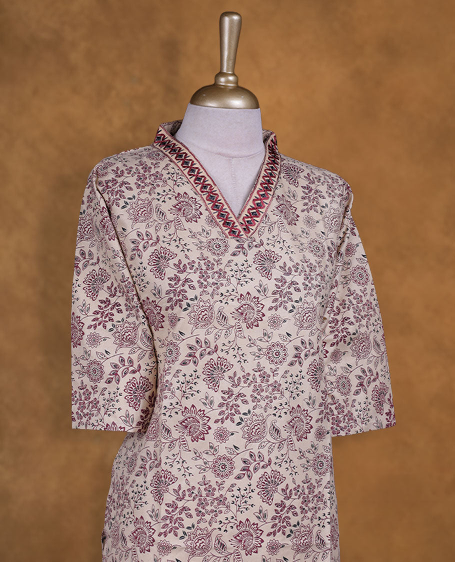 Cream colour kurti with styled with a thread pattern around neckline, print on body knee length design, and a sleeve .