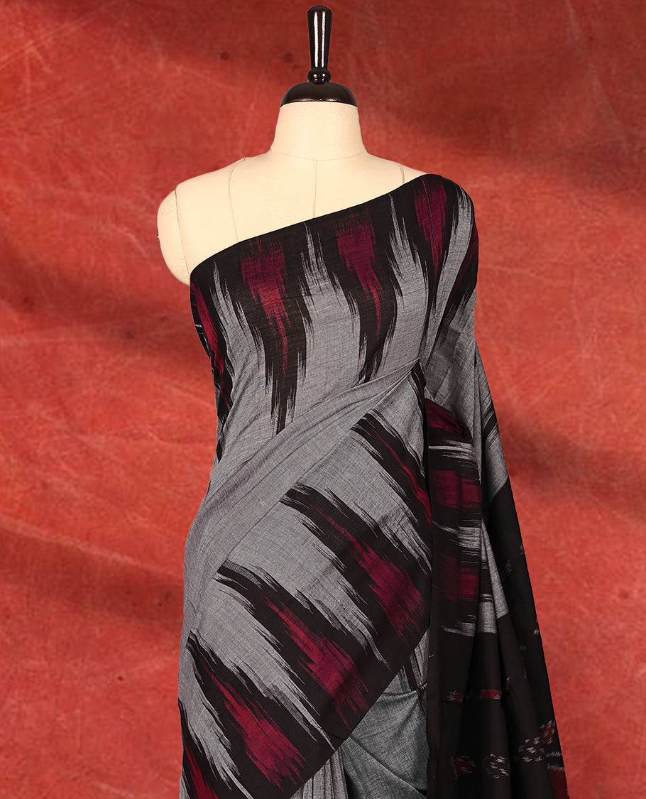 Grey and black colour Ikkat Pochampally saree featuring maroon & black abstract ikkat patterns on the body, traditional geometric ikkat design on the pallu, without Blouse
