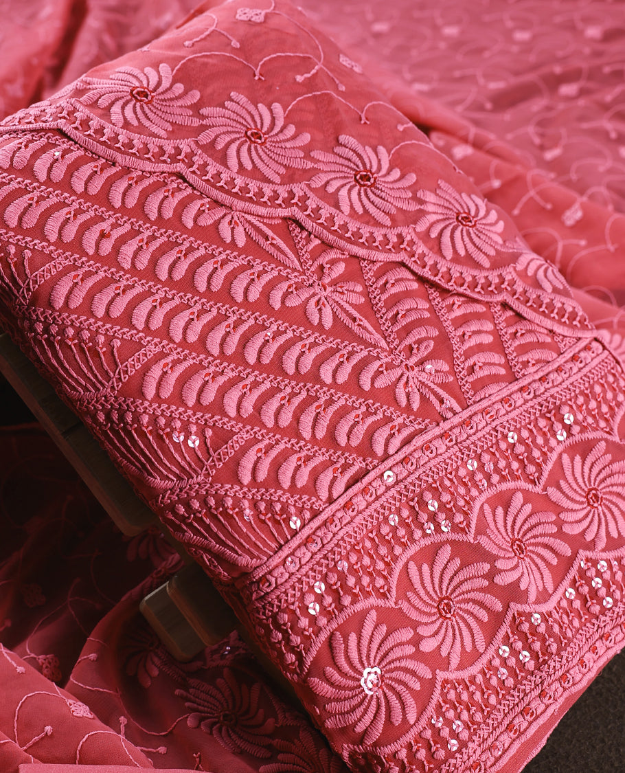 Rose wine colour churidhar material adorned with intricate floral embroidery and sequin highlights, paired with a plain matching bottom and beautifully embroidered dupatta, perfect for festive celebrations and graceful occasions.