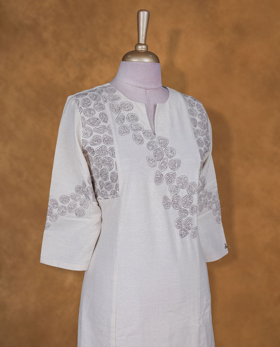 Cream colour kurti BY VISMAY with Brown floral printed motifs, straight calf length silhouette, designed with a round notch neckline and three quarter sleeves.