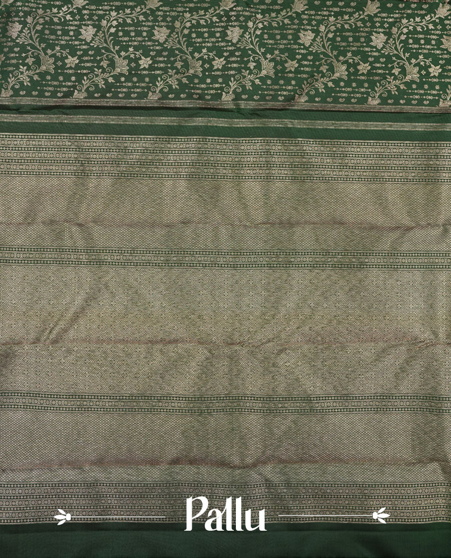 Bottle green colour Kanchipuram pattern Manthrakodi saree featuring kodi floral antique zari jacquard all over, geometric turning border and self zari blouse piece.