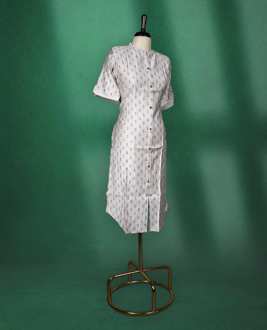 Beige colour cotton kurti with subtle red and grey all-over prints, featuring a mandarin collar, front button placket, and short roll up sleeves, comfortable and stylish choice for everyday wear