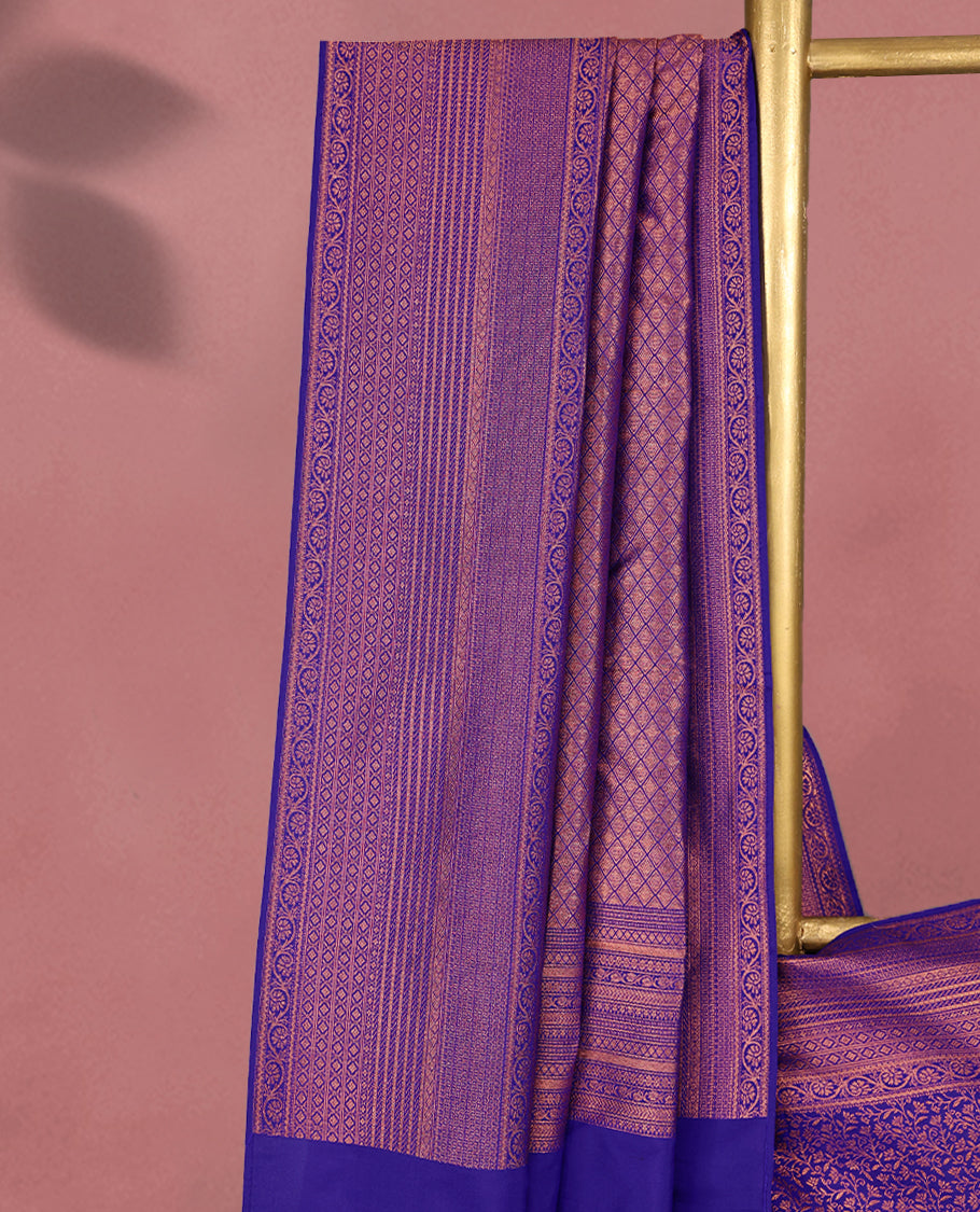 Deep Violet colour Kancheepuram saree featuring an antique zari brocade body, complemented by a traditional border and a matching blouse.