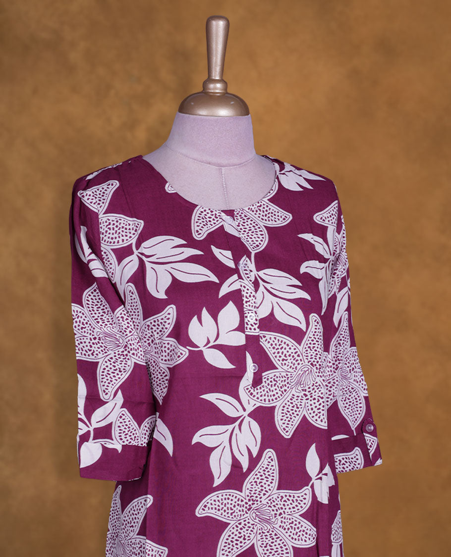 Purple and white colour kurti with White floral prints, knee length design, styled with a round neckline and a sleeve .