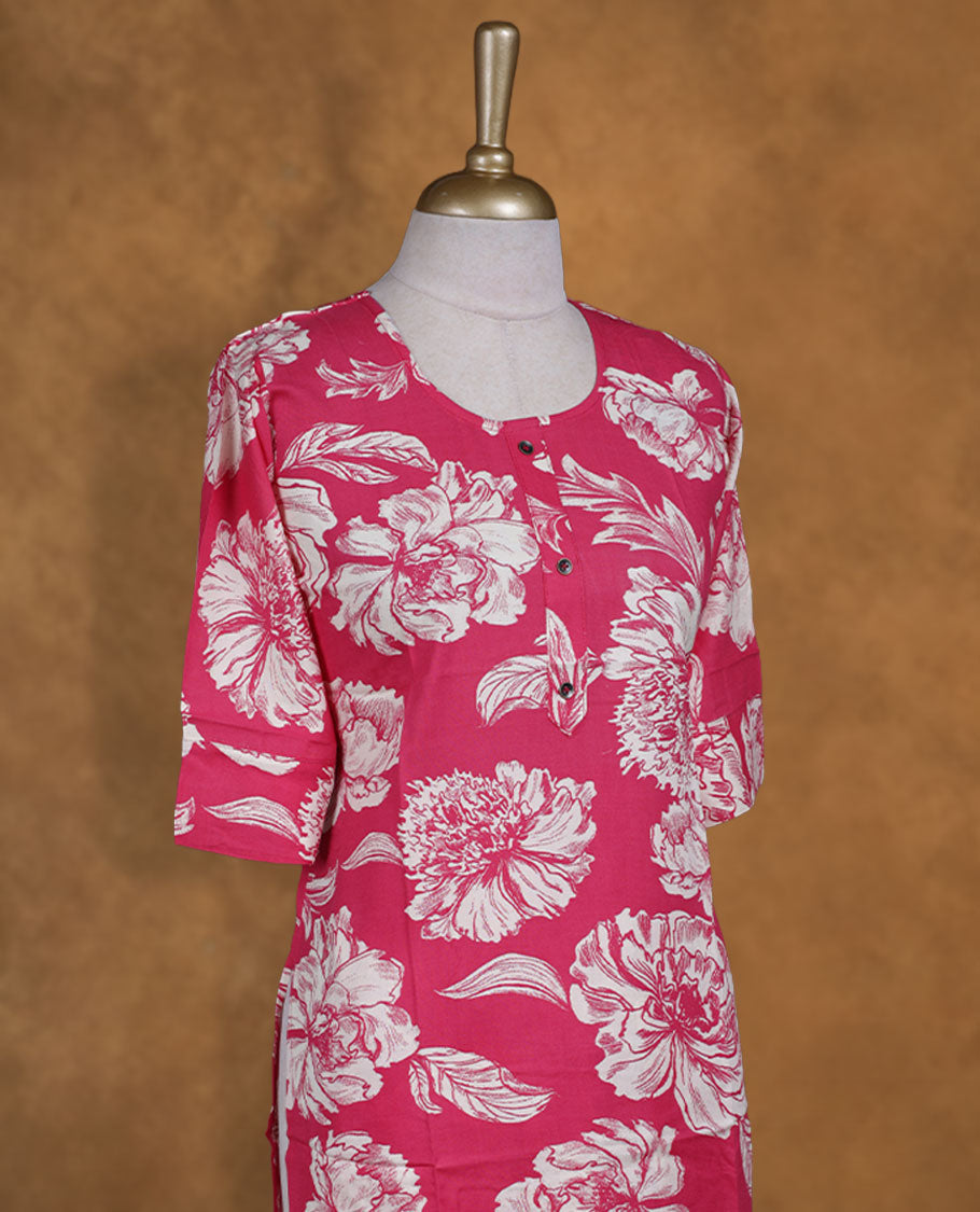 Pink colour coord set adorned with all over off white colour floral prints, featuring a straight cut kurta with round neckline and 3/4th sleeves, paired with matching bottoms.