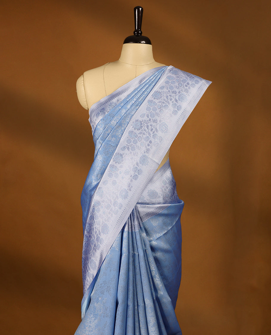 Pastel Blue coloured semi silk saree featuring a Silver coloured Zari design on the body, paired with a Baby Blue coloured border and matching blouse.