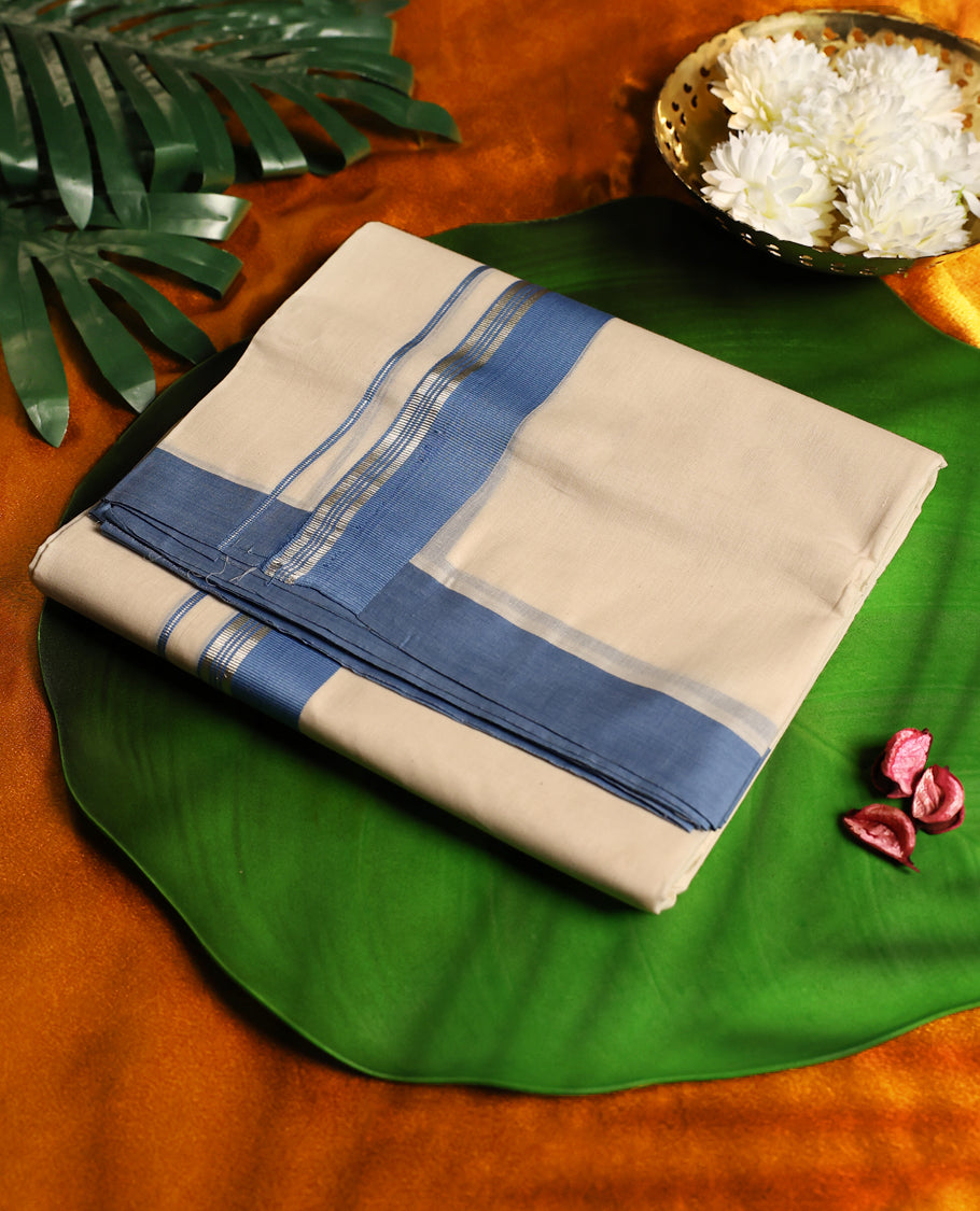 Elegant light ivory colour pure cotton double dhoti featuring a classic sky blue border, crafted for traditional comfort and timeless style, perfect for festive and formal occasions.