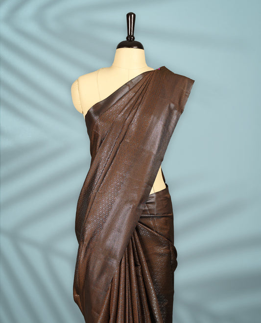 Deep Brown Colour semi silk saree featuring an intricate Zari  motif weave across the body, paired with a zari worked border with matching blouse.