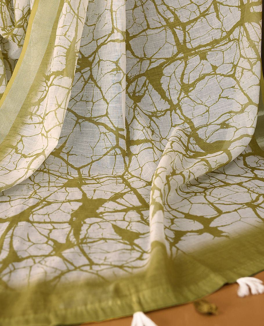 White cotton saree featuring light olive green abstract patterns and a soft matching border with Matching Blouse