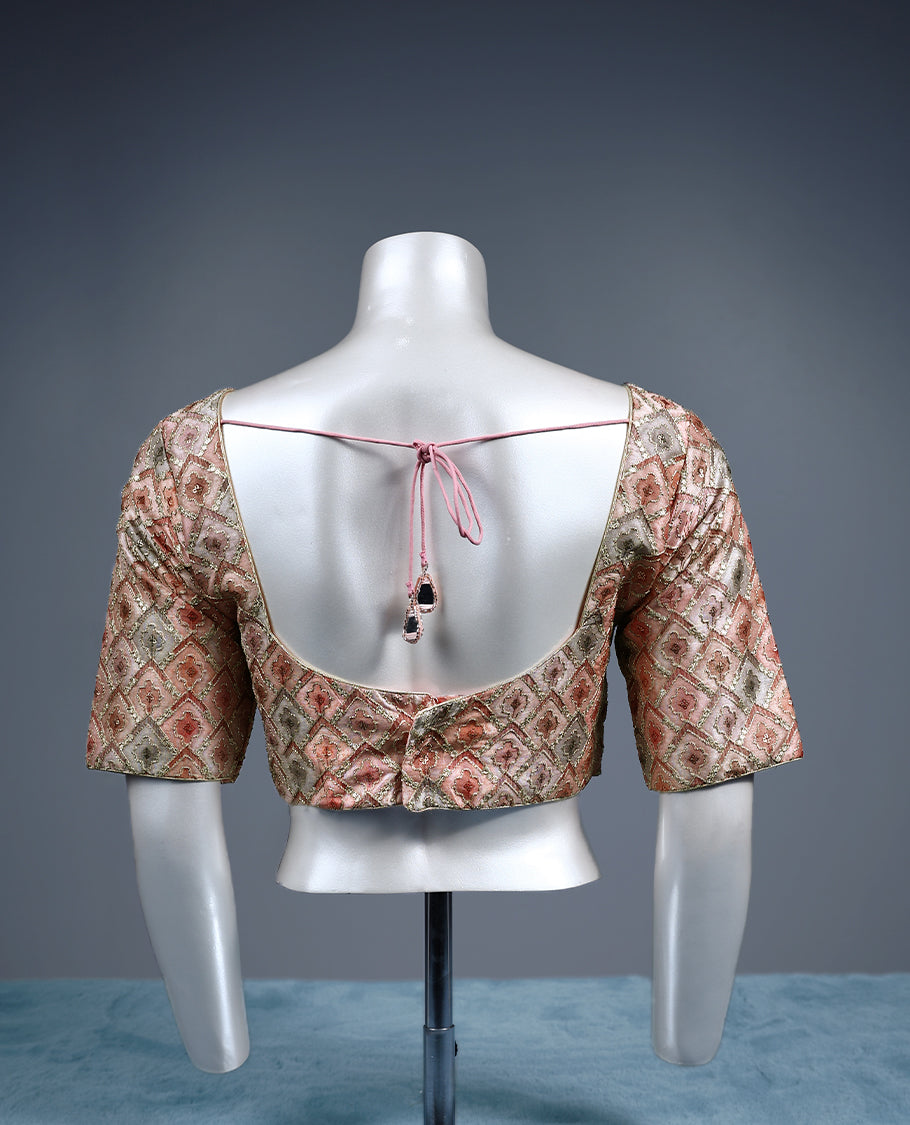 Multicolour designer padded readymade blouse featuring a pastel diamond patterned brocade in soft shades of peach, green, and beige, enhanced with subtle gold zari highlights and elbow length sleeves
