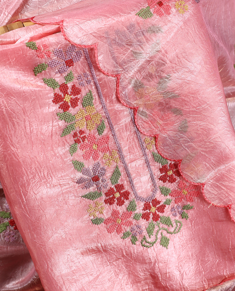 Baby pink colour churidhar material with elegant floral embroidery on the neckline and scalloped edges, paired with a plain matching bottom and a dupatta highlighted with floral motifs.