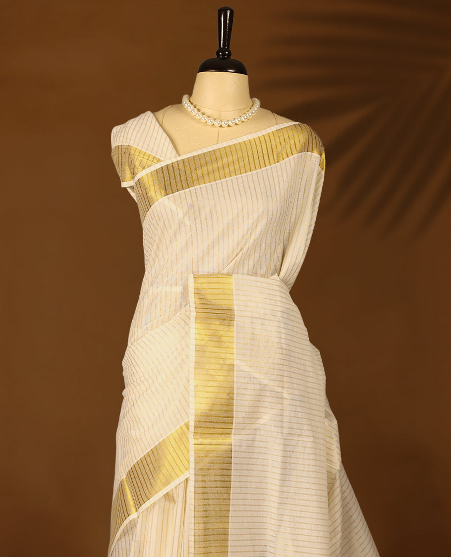 Kerala cotton saree with fine golden stripes and a lustrous zari border with Matching Blouse