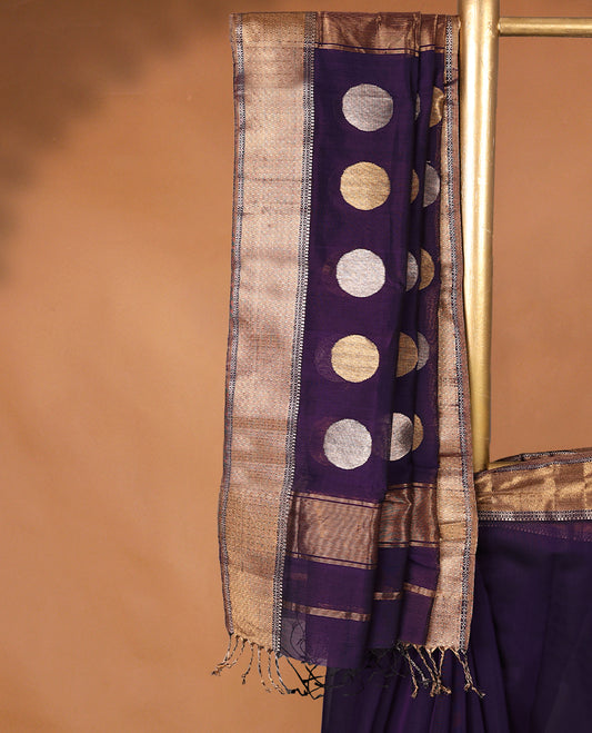 Purple colour Maheshwari Cotton saree featuring Antique Zari bindi Patterns across the entire body, complemented by a traditional Gold Zari border & Pallu, with a matching blouse.