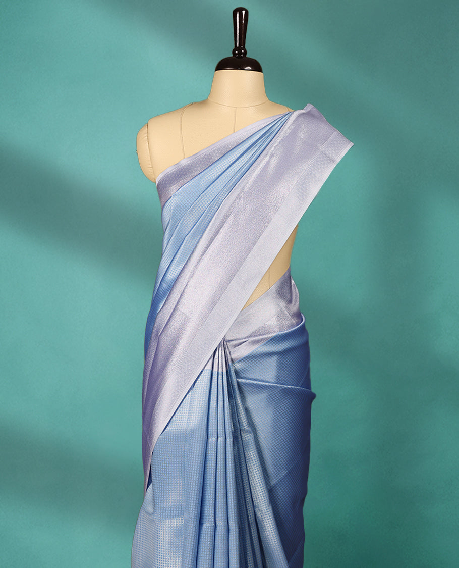 Light Blue coloured semi silk saree featuring a Check design on the body, paired with a Baby Blue coloured border and matching blouse.