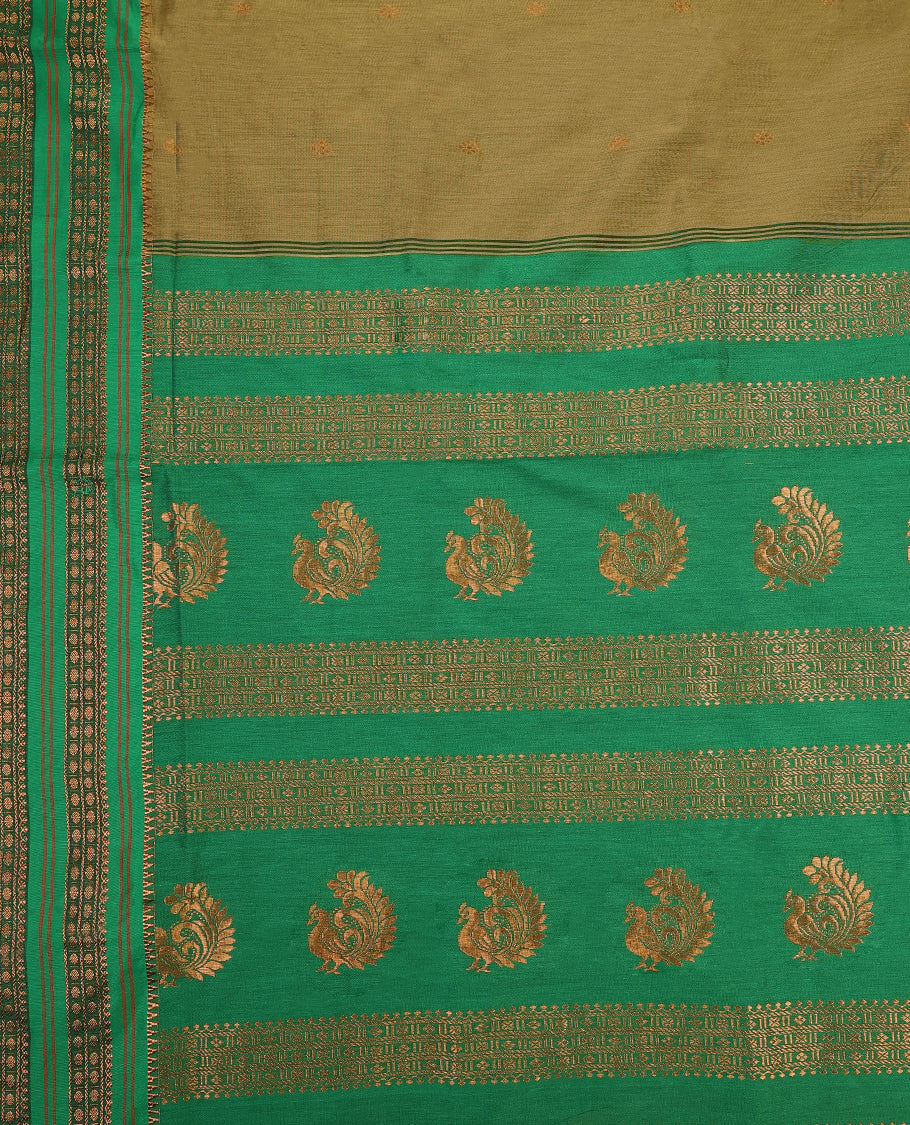 Warm olive and Green Kalyani cotton saree adorned with delicate woven buttas on the body, complemented by intricate zari woven border and pallu in green, paired with a matching blouse