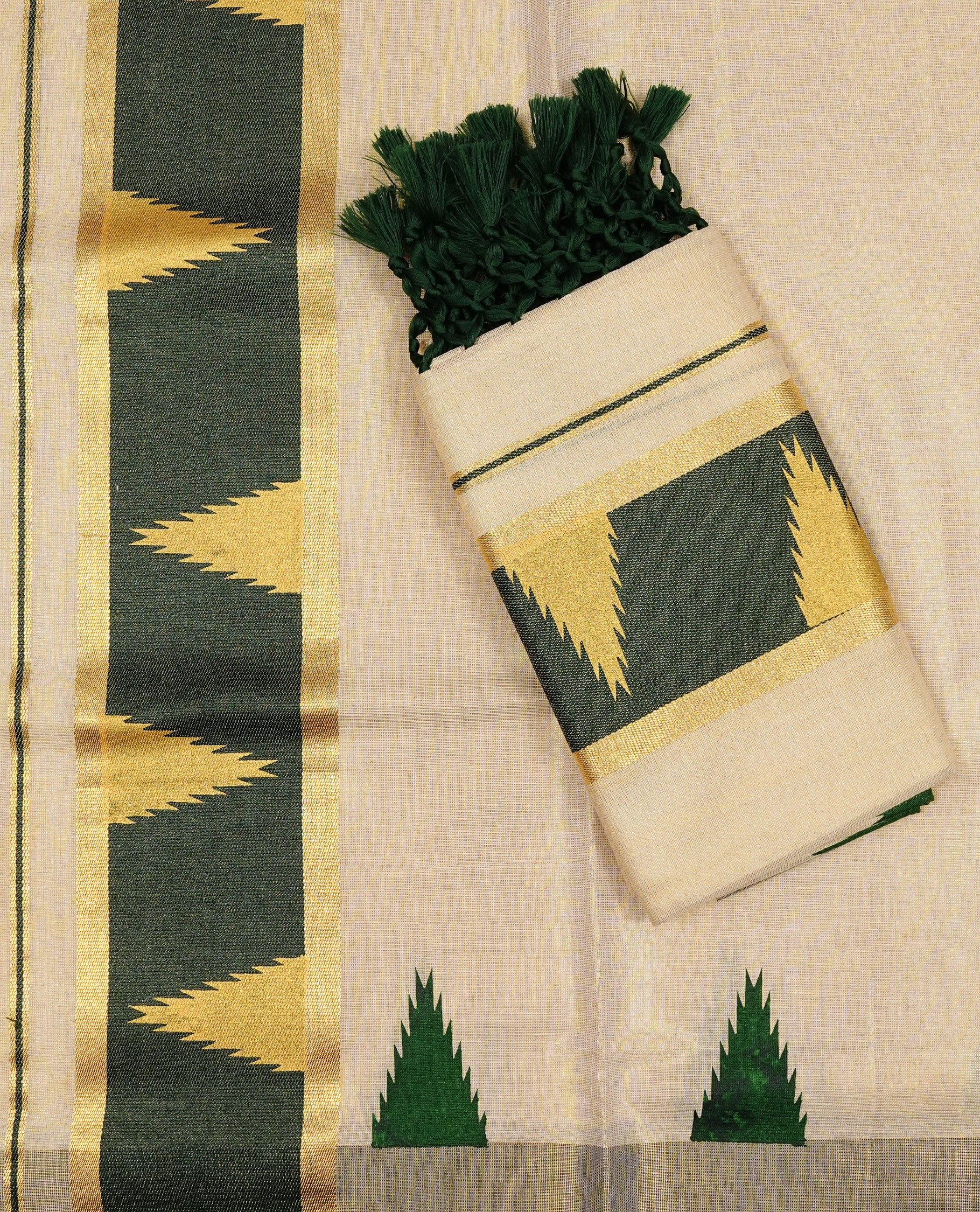 Cream colour Tissue silk set mund Featuring Elegant plain body, Complemented by Temple print on Green colour & gold zari border.