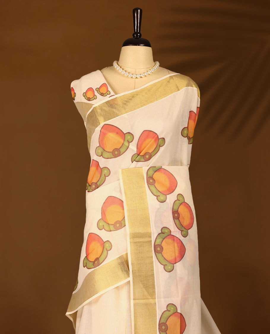 Kerala cotton saree with fine Prints and a Golden lustrous zari border with Matching Blouse