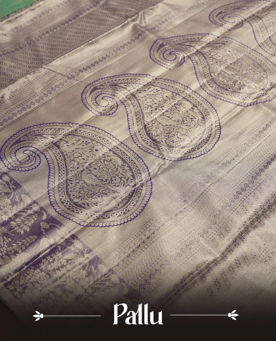 Aqua green colour and Antique gold Zari Tissue Brocade Saree features intricate Motifs on body and pastel purple colour fancy border & pallu with forest patterns, paired with matching blouse