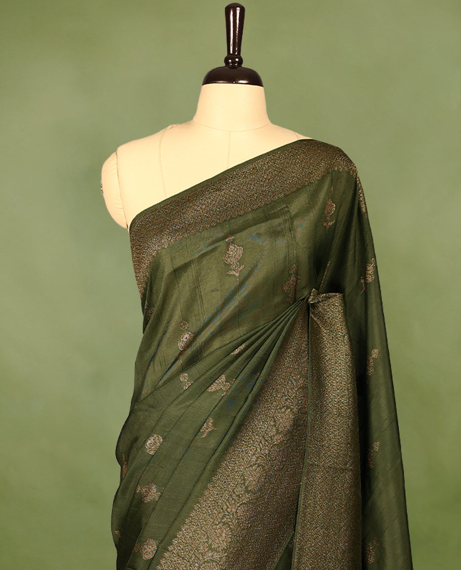 Army green semi-Banaras tussar georgette saree embellished with antique zari motifs across the body, complemented by a rich heritage Banaras border and paired with a matching blouse.
