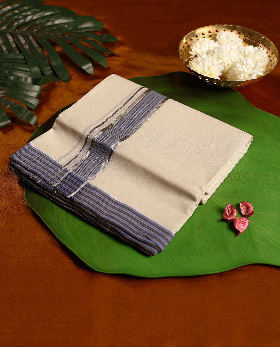 Off white pure handloom double dhoti featuring a light blue kara with fine line patterns, crafted with traditional weaving for lasting comfort and elegance, perfect for rituals, temple wear, and festive occasions