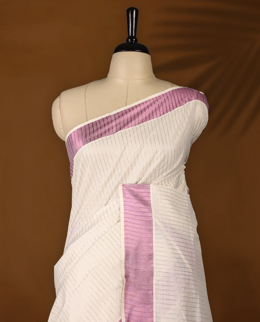Elegant off white colour cotton Kerala saree featuring a RoseGold stripes on body, with Rosegold Colour kasavu border offering a classic and graceful look, paired with a matching blouse.