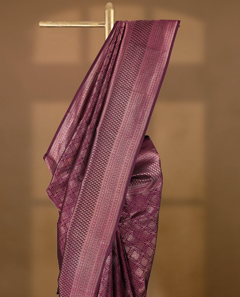 Mulberry purple Colour Manthrakodi saree featuring Antique Zari geometric brocade pattern on the body, complemented by a brocade border and a matching self coloured blouse.