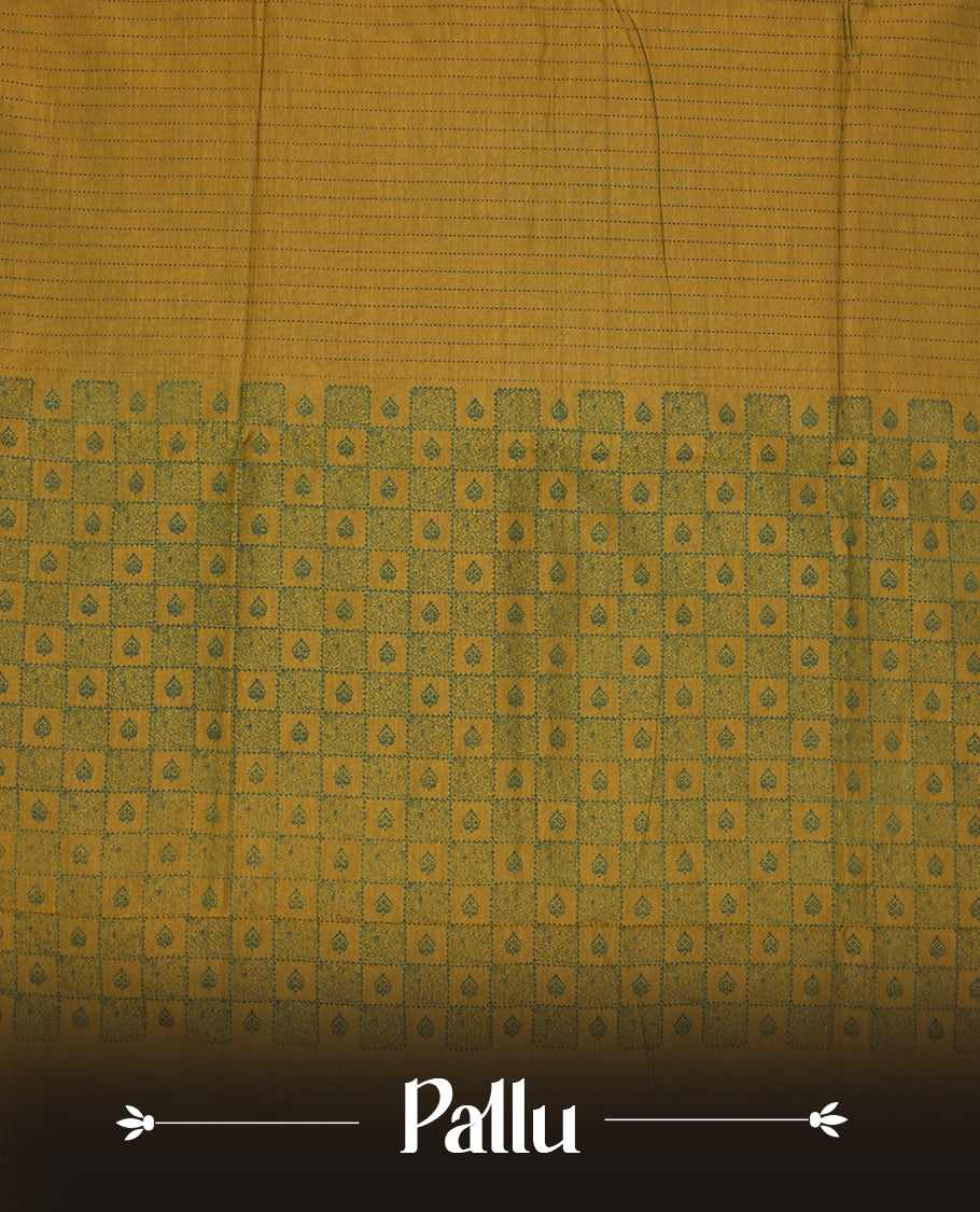 Dark Mustard colour poly cotton saree with black vertical dotted line pattern on the body, paired with a matching pallu featuring zigzag geometric border, and a coordinated all‑over black stylised fleur‑de‑lis printed blouse piece.
