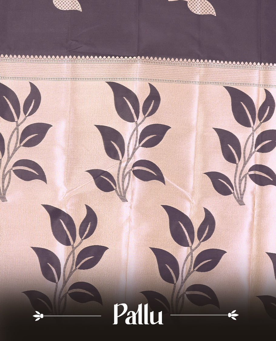 Black Semi Silk Saree with Rose Gold Satin-Finish Pallu Featuring Bold Leaf Motifs, Geometric Zari Edging and Tassels, Paired with Coordinated Blouse Piece