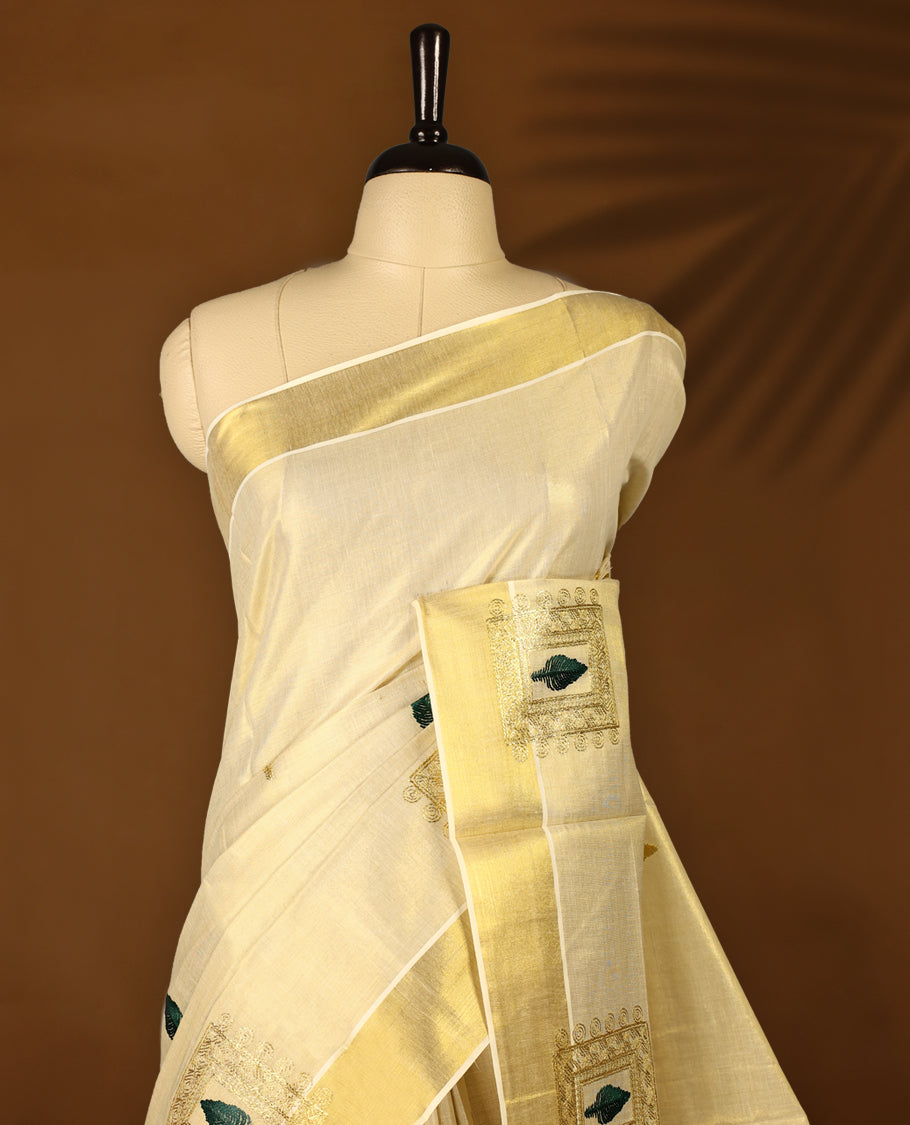Light Gold colour Tissue Kerala saree featuring Embroidery work on body and a beautifully woven Gold Kasavu border, paired with a matching blouse perfect for festive occasions.