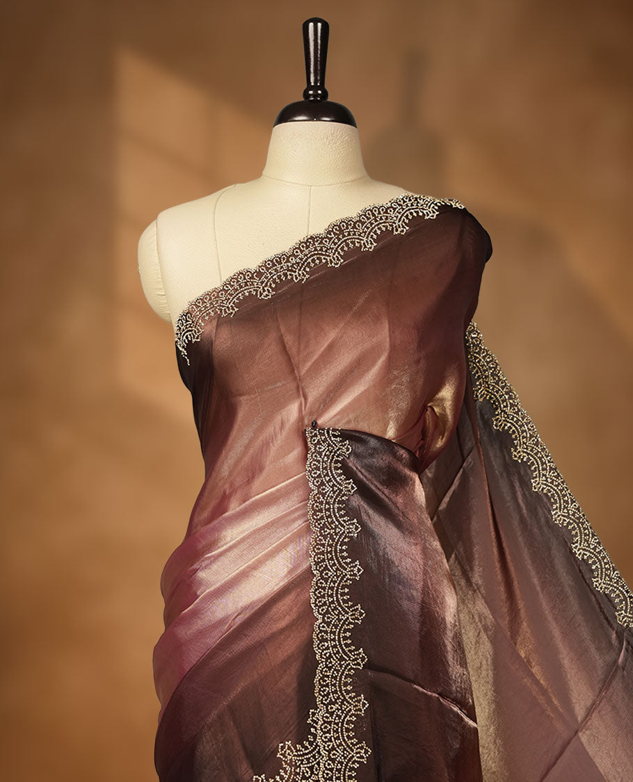 Dark Brown colour net shimmer fancy saree with a plain body, paired with a delicate stone worked border, with matching blouse