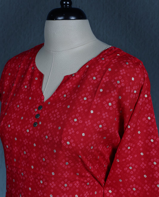 Red colour kurti adorned with an all over small geometric print, styled with a chic notch neckline enhanced by delicate button detailing, and finished with comfortable three quarter sleeves